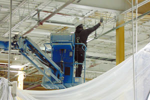 spray painting steel ceiling structures at a Goshen, Indiana facility