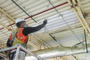 spray painting of a factory ceiling by a Detroit Michigan painting contractor