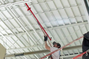 industrial painter painting pipes in Troy, MI