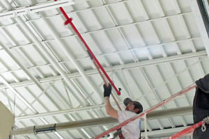 industrial painter painting pipes in Troy, MI